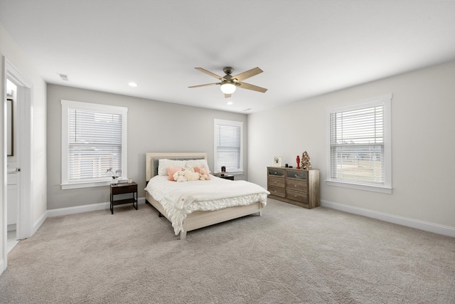 carpeted bedroom with ceiling fan