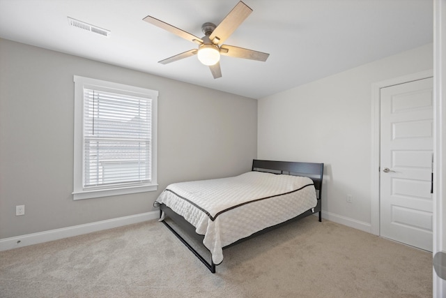 bedroom with ceiling fan and light colored carpet