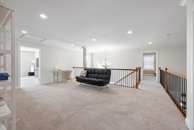 living area with light carpet, a chandelier, and ornamental molding