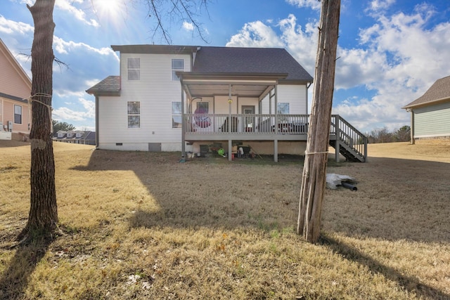 back of house with a yard and a wooden deck