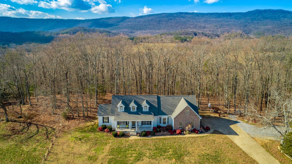 birds eye view of property with a mountain view