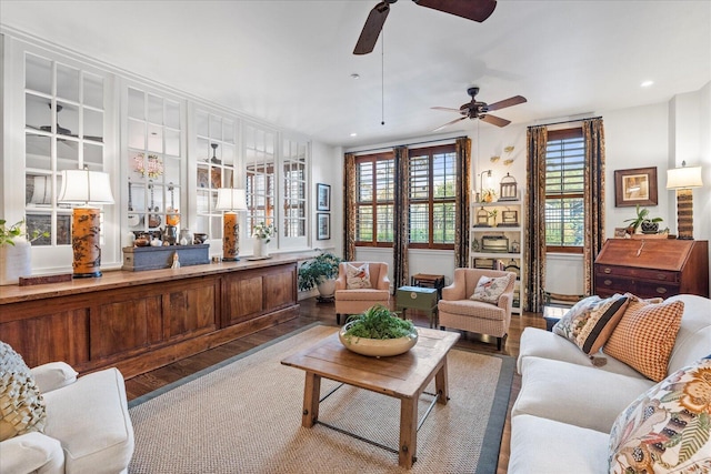 living room featuring light hardwood / wood-style floors and ceiling fan