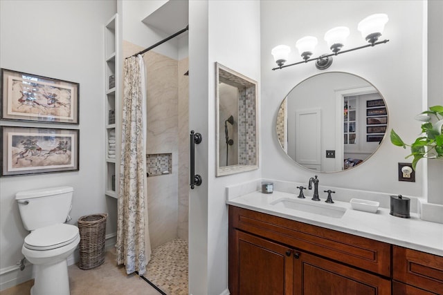 bathroom with tile patterned floors, toilet, vanity, and a shower with shower curtain