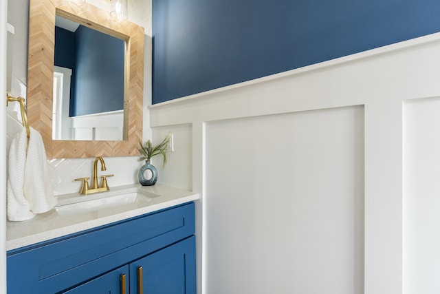 bathroom featuring decorative backsplash and vanity