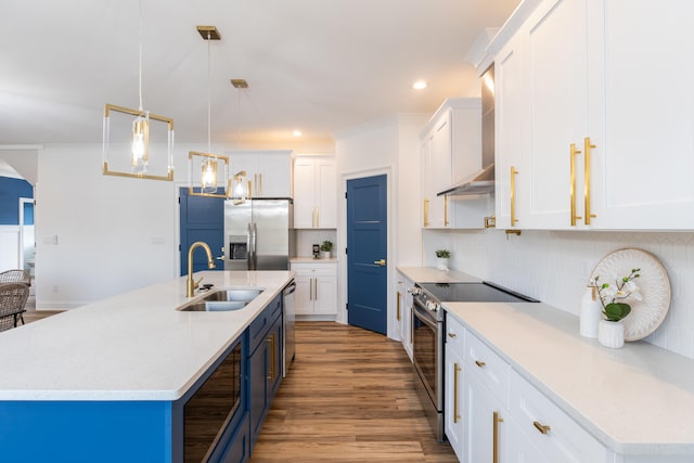 kitchen with decorative light fixtures, white cabinetry, appliances with stainless steel finishes, and tasteful backsplash