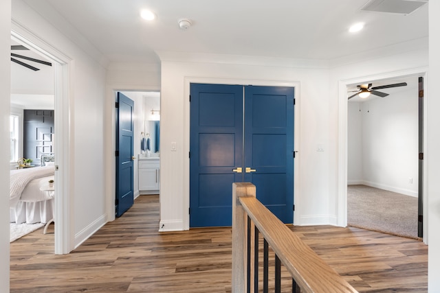 hall featuring dark hardwood / wood-style flooring and ornamental molding