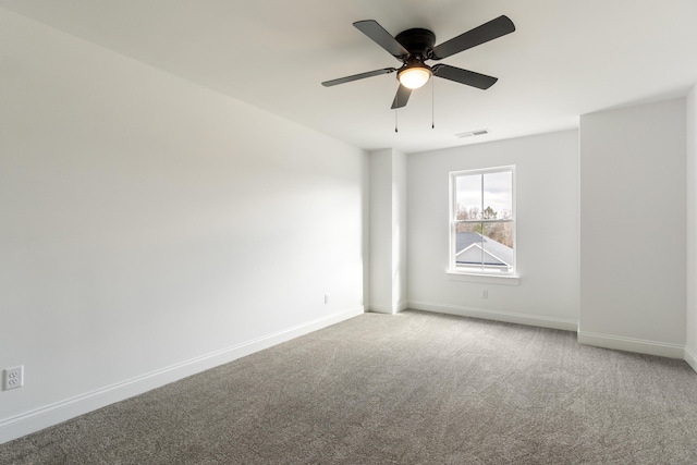 empty room with carpet flooring and ceiling fan