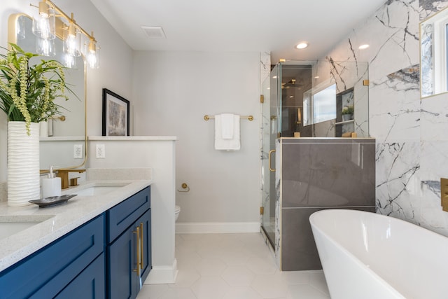 full bathroom with tile patterned floors, vanity, toilet, and independent shower and bath