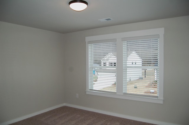 unfurnished room with carpet floors