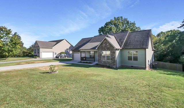 view of front facade featuring cooling unit, a garage, and a front lawn