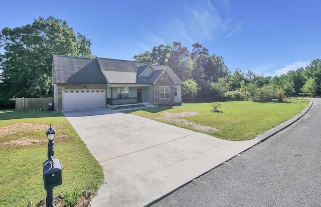 view of front of house featuring a front yard and a garage