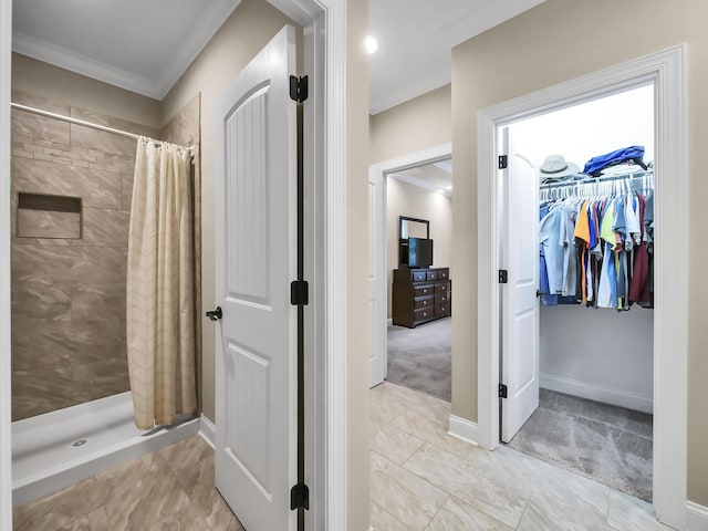 bathroom with ornamental molding and walk in shower