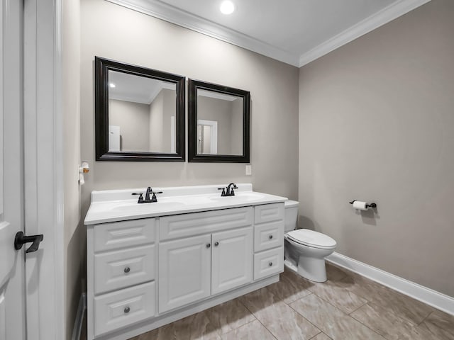 bathroom featuring vanity, toilet, and ornamental molding