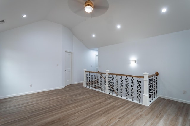 additional living space featuring light hardwood / wood-style floors, lofted ceiling, and ceiling fan