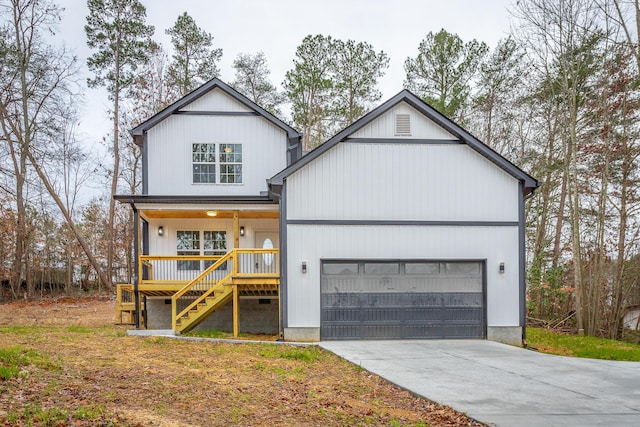 modern inspired farmhouse with a garage and covered porch