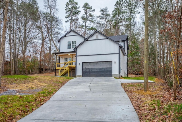 view of front facade featuring covered porch and a garage