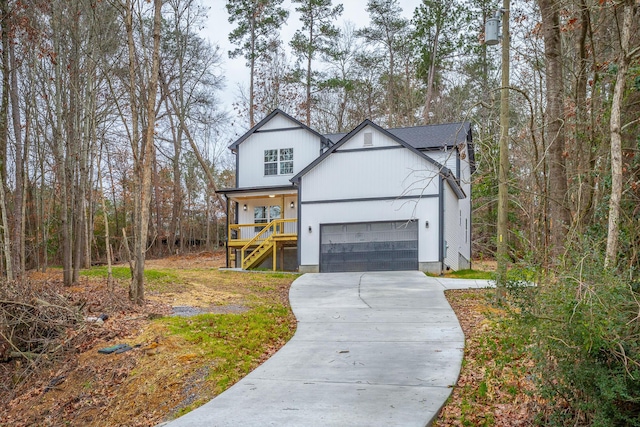 view of front of property with a garage and a porch