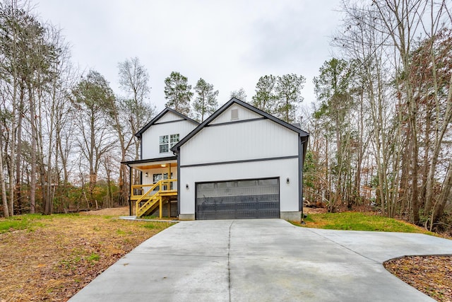 view of front of property featuring a garage and covered porch