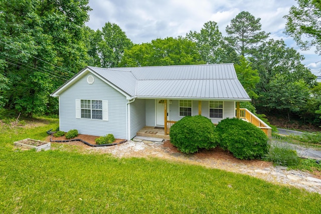 view of front of house with covered porch and a front yard