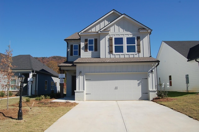 view of front facade with a garage and a front yard