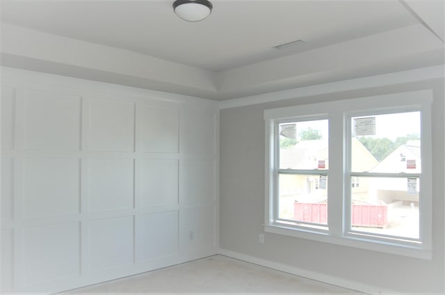 empty room featuring concrete flooring and plenty of natural light