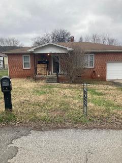 single story home with a garage