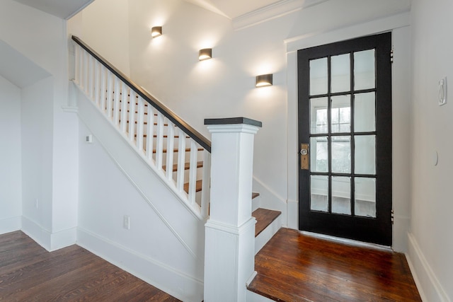 entrance foyer with dark hardwood / wood-style floors