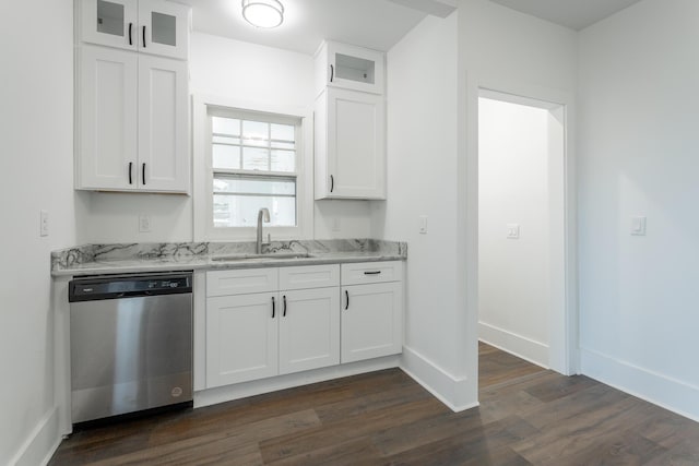 kitchen with white cabinetry, dishwasher, and sink