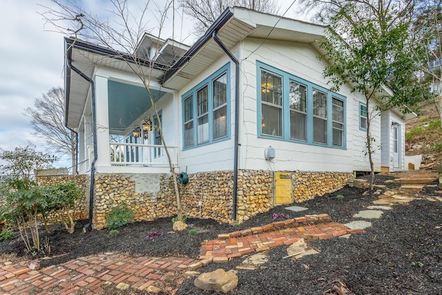 view of home's exterior with a porch