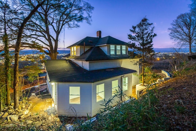 view of property exterior at dusk