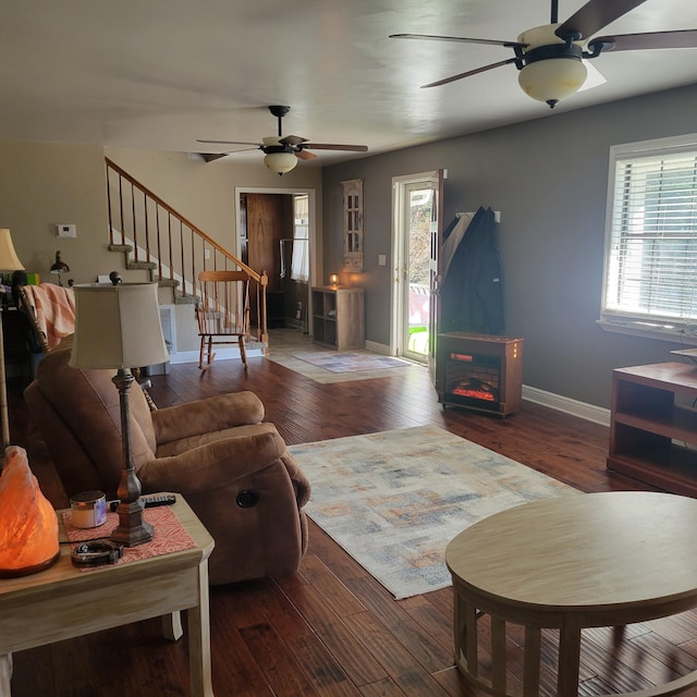 living room with ceiling fan and hardwood / wood-style flooring