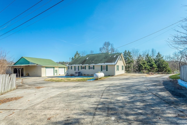 back of property with a garage