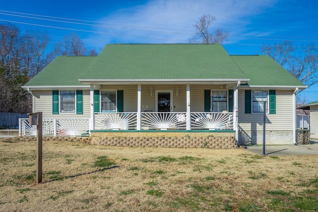 view of front of house with a front lawn and a porch