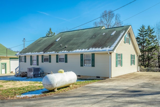 rear view of house with central air condition unit