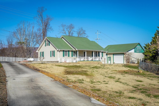 view of front of home with a front lawn, a porch, and a garage