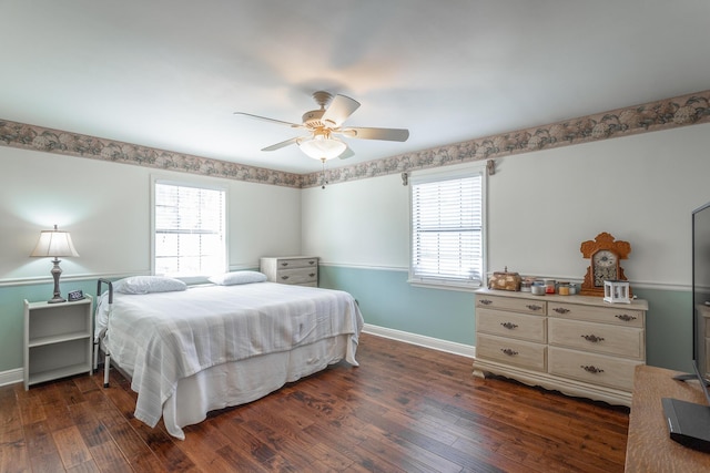 bedroom featuring ceiling fan and dark wood-type flooring