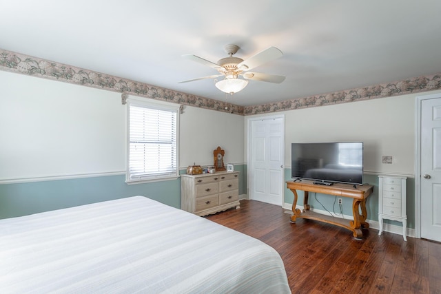 bedroom featuring ceiling fan and dark hardwood / wood-style floors