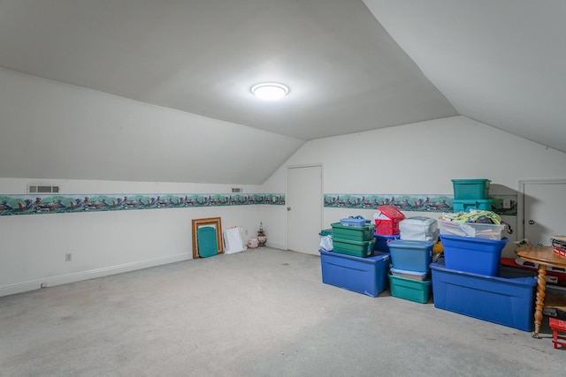 bonus room featuring carpet and vaulted ceiling