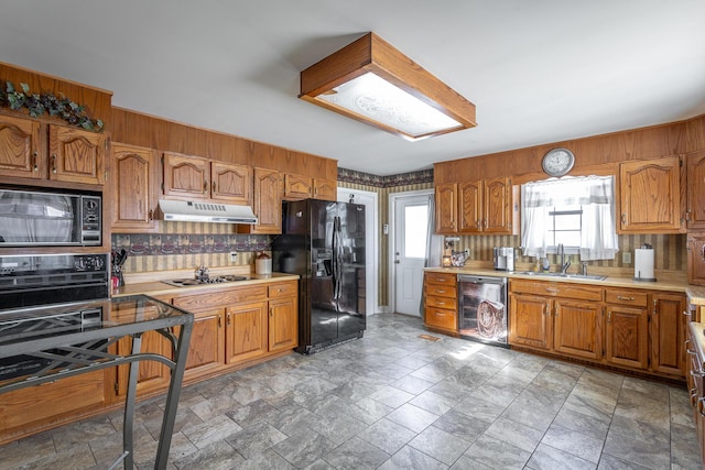 kitchen featuring black appliances and sink