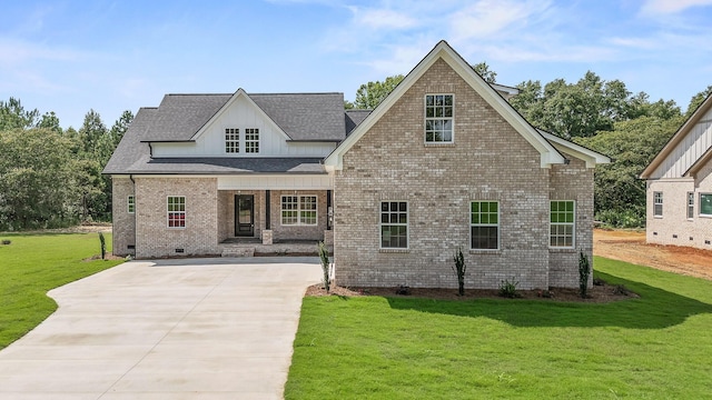 view of front of home with a porch and a front lawn