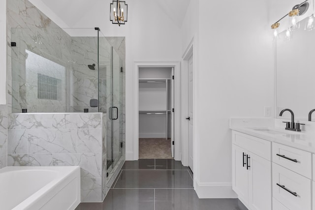 bathroom featuring vanity, tile patterned floors, vaulted ceiling, independent shower and bath, and a notable chandelier