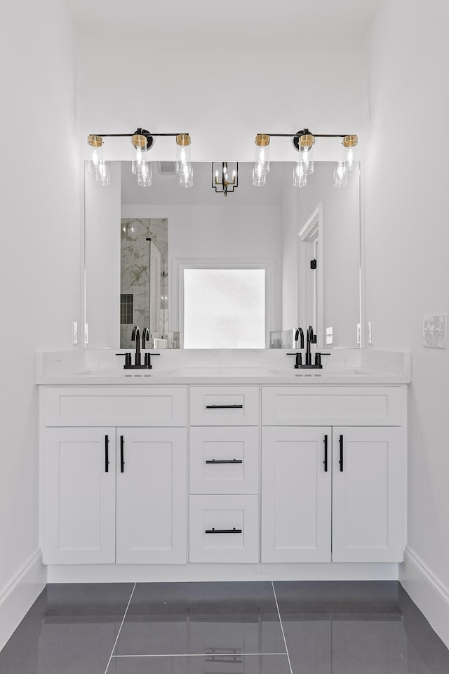 bathroom featuring tile patterned floors, vanity, and an enclosed shower