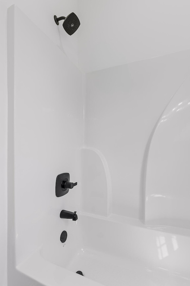 room details with bathtub / shower combination