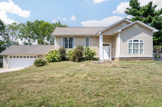 view of front of house featuring a garage and a front yard