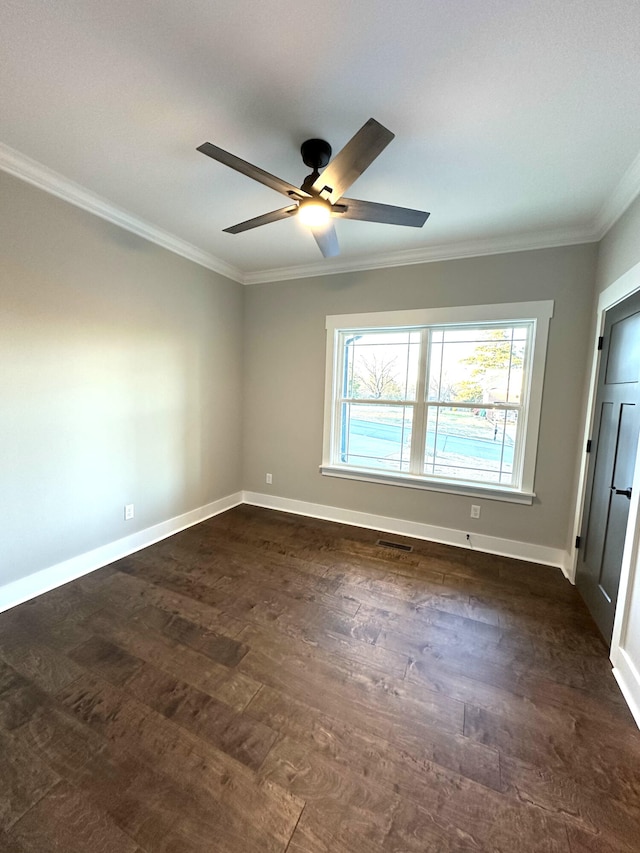 spare room featuring ceiling fan and ornamental molding