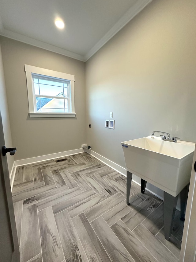 laundry room featuring crown molding, washer hookup, and hookup for an electric dryer