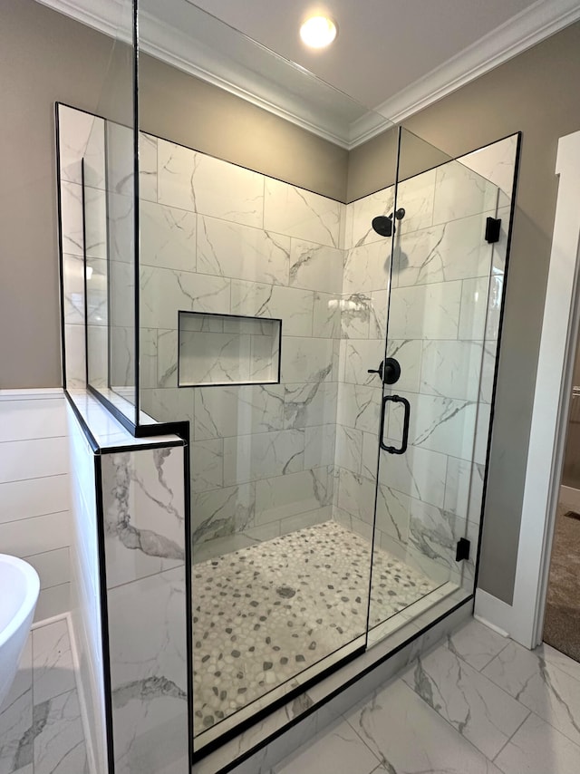 bathroom featuring independent shower and bath and ornamental molding