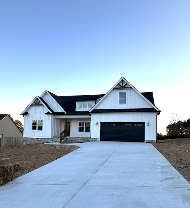 modern farmhouse style home with a garage