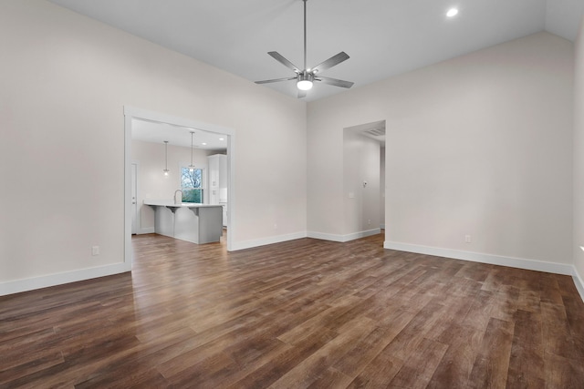 interior space featuring wood-type flooring, ceiling fan, and lofted ceiling