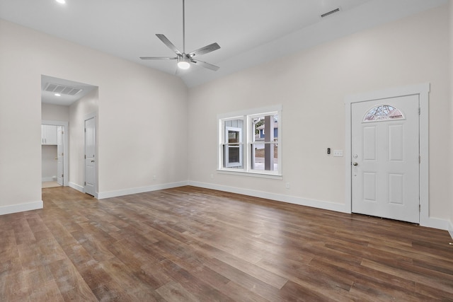 unfurnished living room with ceiling fan, hardwood / wood-style floors, and vaulted ceiling